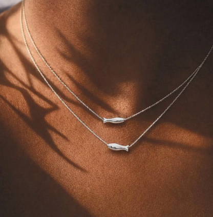 Dainty layered gold fish necklace on  coastal summer jewelry by LP-Muse.